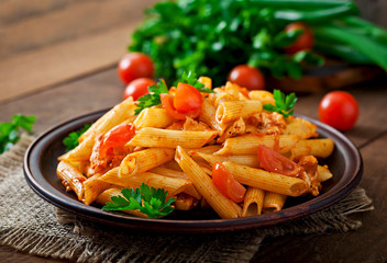 Wall Mural - Penne pasta in tomato sauce with chicken, tomatoes