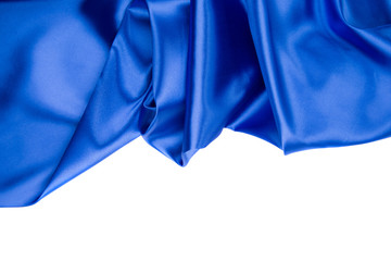 Blue silk drapery texture close up.