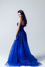 Young Woman In A Beautiful Blue Evening Dress