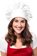 © stockyimages - Beautiful female chef over white