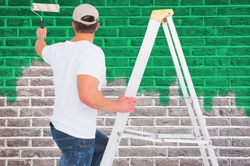 Poster - Handyman climbing ladder while using paint roller