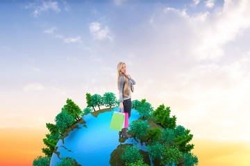 Poster - Blonde in winter clothes holding shopping bags