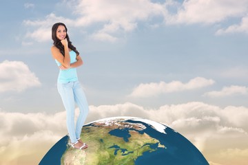 Poster - Composite image of casual brunette smiling at camera
