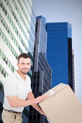 Poster - Composite image of delivery man pushing trolley of boxes