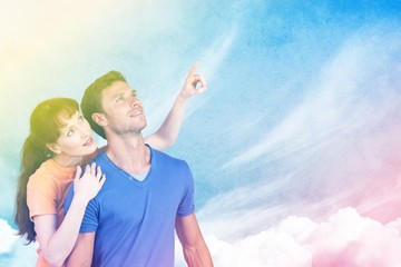 Poster - Composite image of happy couple looking upwards