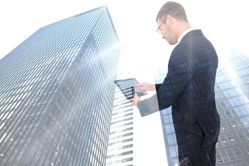 Aufkleber - Composite image of businessman using his tablet pc 