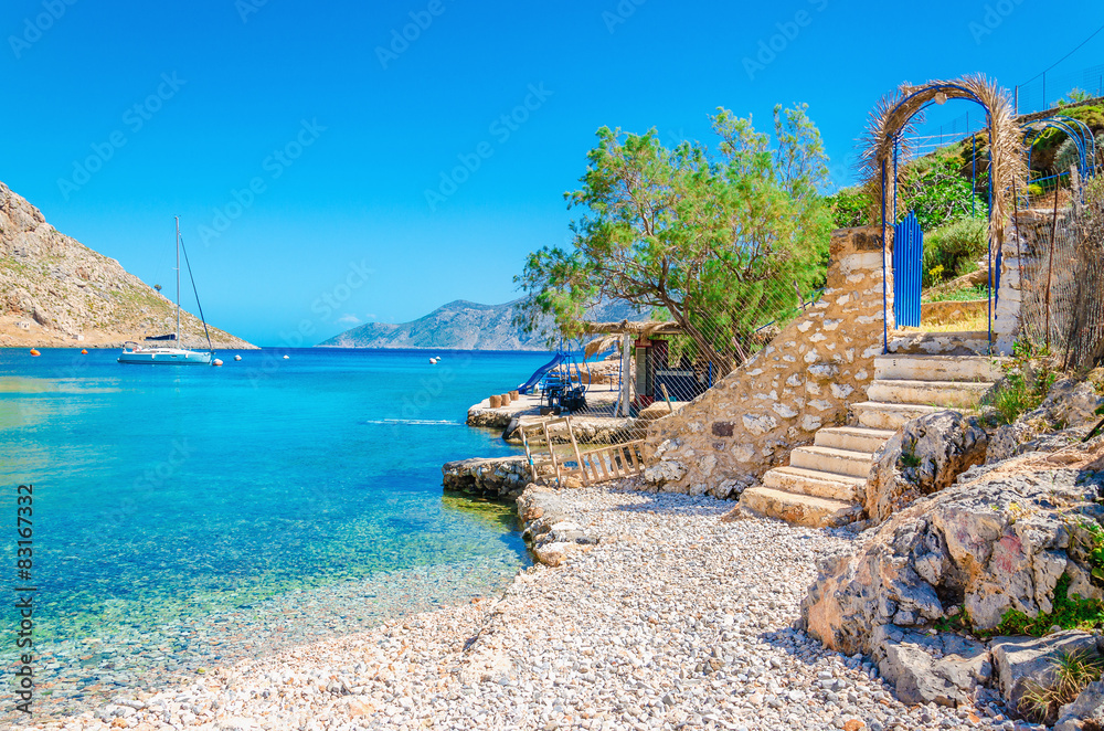 Stairs from sandy beach on Greece island Kalymnos - obrazy, fototapety, plakaty 