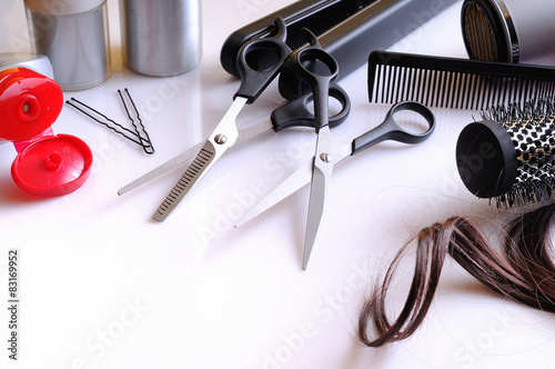 Set hairdressing articles on a white table composition Poster
