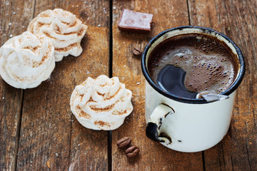 white meringue on a dark wooden background retro