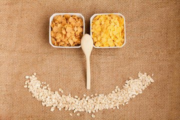 Three types of flakes for nice breakfast in three white bowls. B