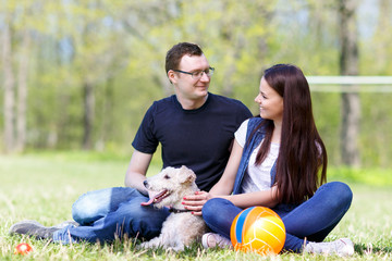 Happy young couple and  dog