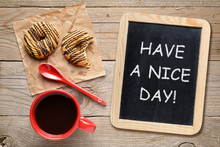 Coffee Cup And Blackboard With Have A Nice Day! Phrase