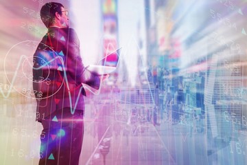 Poster - Composite image of businessman looking up holding laptop