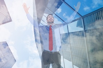 Poster - Composite image of happy cheering businessman raising his arms