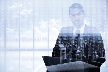 Poster - Cheerful businessman with laptop using smartphone