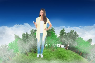 Poster - Composite image of happy casual woman sending a text