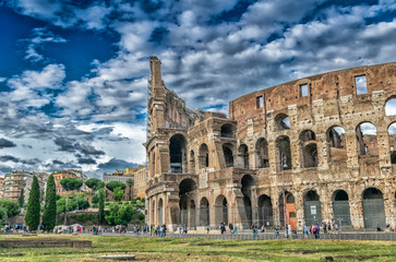 Wall Mural - ROME - MAY 20, 2014: Tourists visit Colosseum. The city is visit