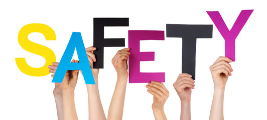 many people hands holding colorful word safety