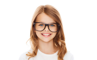 Wall Mural - smiling cute little girl with black eyeglasses