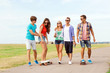 © Syda Productions - group of smiling teenagers with skateboards