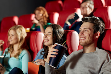 Canvas Print - happy friends watching movie in theater