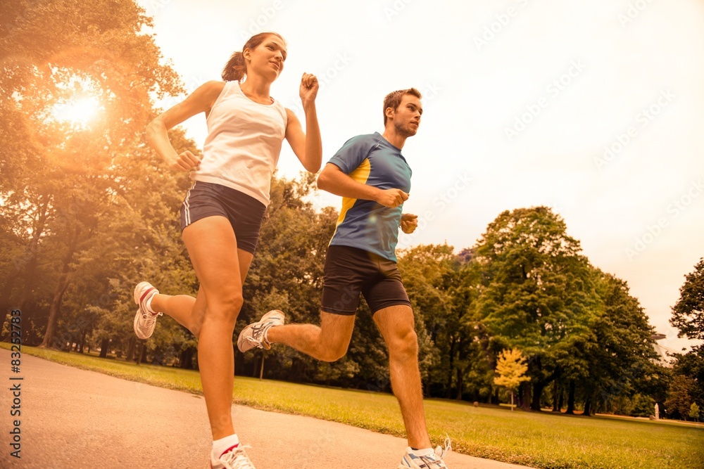 Jogging together - sport young couple - obrazy, fototapety, plakaty 