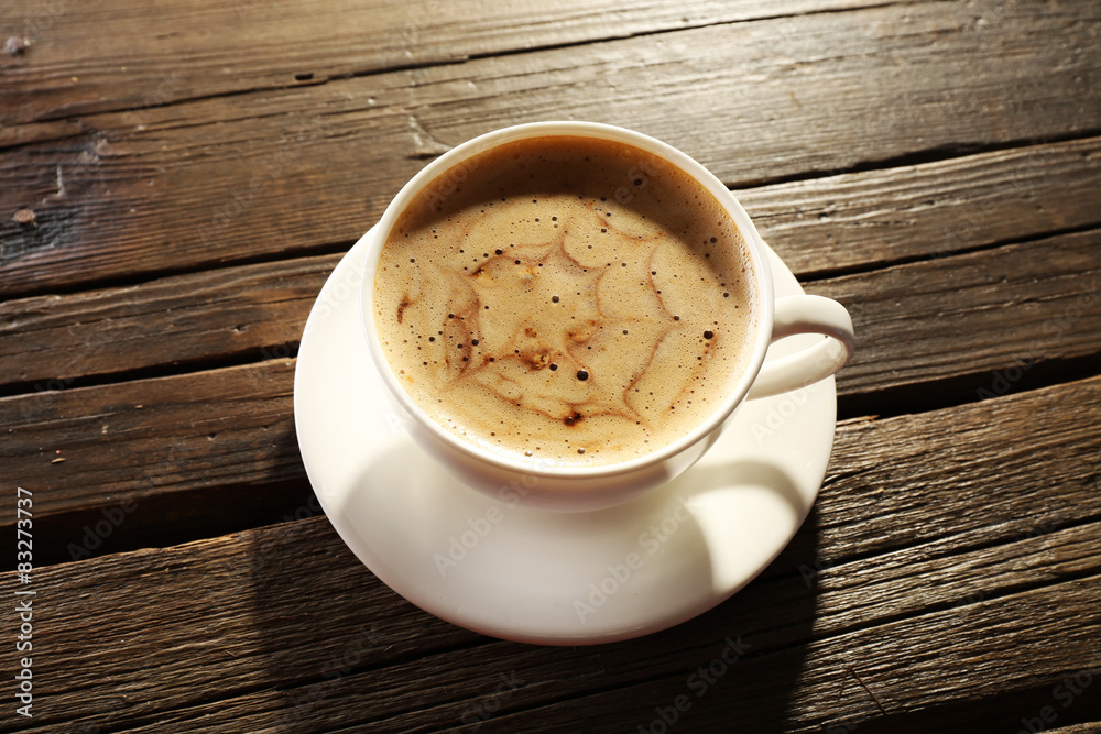 Cup of coffee latte art on wooden background