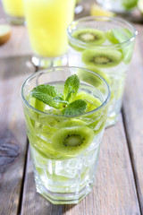 Poster - Glasses of cocktails on wooden table, closeup