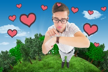 Poster - Composite image of geeky hipster pointing to his watch