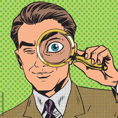 Valokuva The man is a detective looking through magnifying glass search p