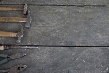 Wall Mural - Set of antique tools on an old wood background