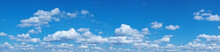 White Heap Clouds In The Blue Sky.
