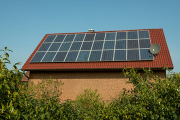 Wall Mural - Solar panel on a red roof