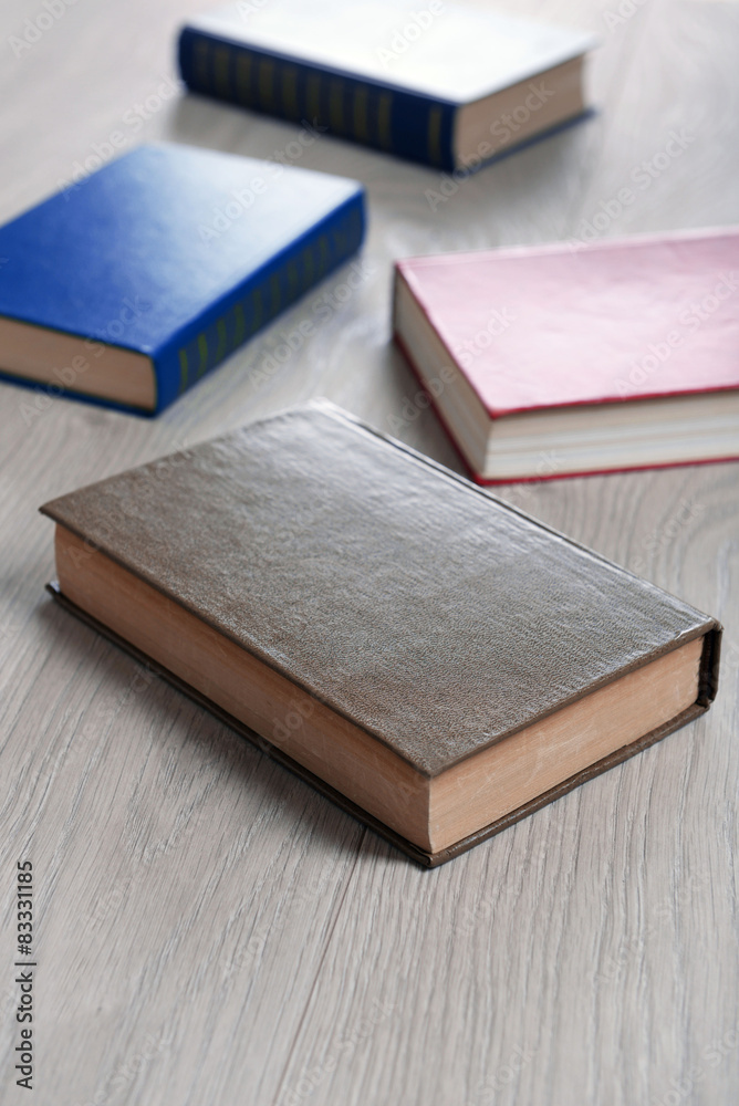Heap of books on wooden background