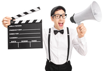 Canvas Print - Young movie director speaking on a megaphone