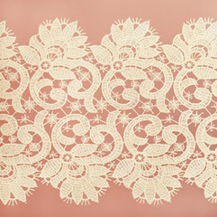 Wall Mural - White lace on pink background