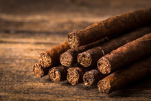 Quality Cigars On An Old Wooden Table