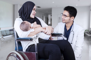 Poster - Mother on wheelchair talking with doctor