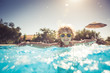 © Sunny studio - Child playing in swimming pool