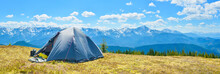 Panoramic View Of Tourist Tent And A Mountain Range