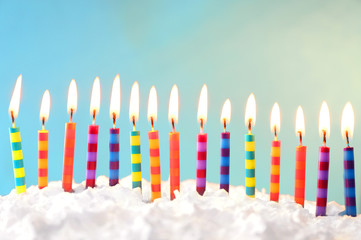 Sticker - Birthday cake with candles on light background