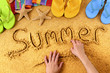 Summer beach writing word written in sand by child hands sunny tropical holiday vacation photo