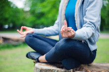 Woman In Meditation Pose Displaying Rude Gesture