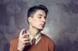 © fotofabrika - Young man using fragrance