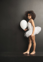 Wall Mural - Conceptual picture of a little ballet dancer with a ballon