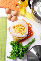 Canvas Print - Ingredients for cooking on kitchen table close up