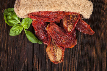 Wall Mural - Sundried tomatoes on wooden table.