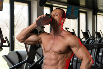 Bodybuilder Drinking Water From Shaker