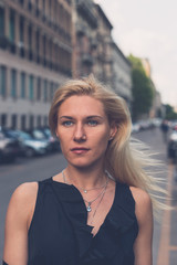 Beautiful girl posing in the city streets