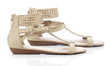 Beige sandals with studs on a white background 